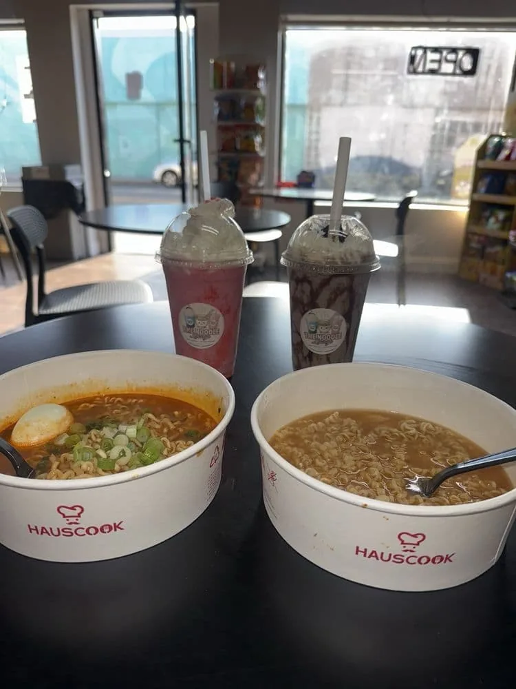 Two ramen bowls with shakes by the window