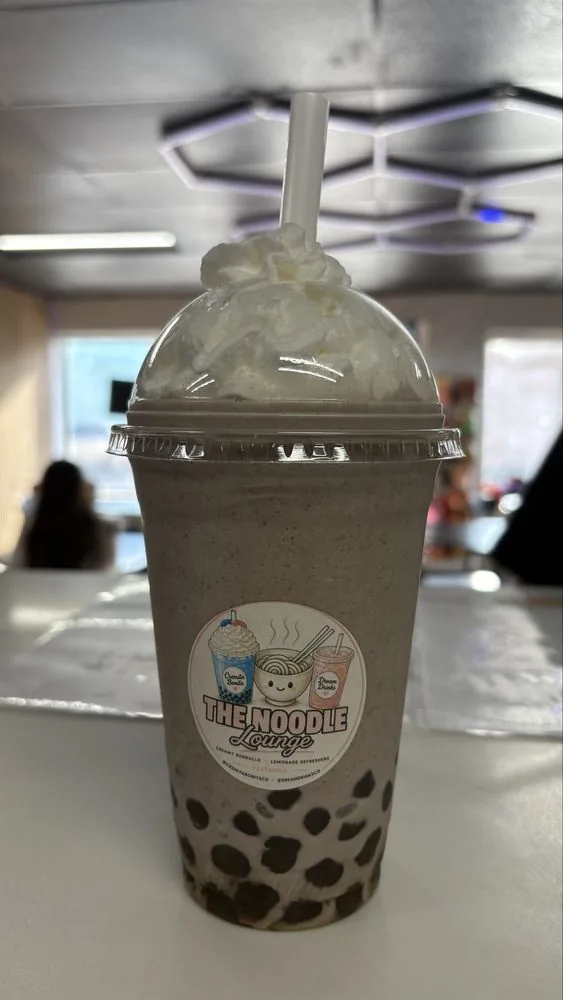 Cookies and cream shake with whipped cream dome and boba pearls
