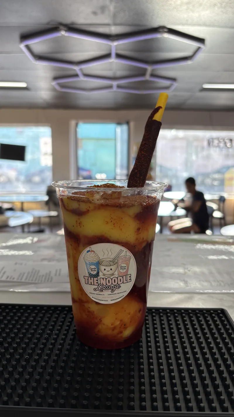 Mangonada layered with chamoy, served with a tamarind straw